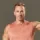 a-handsome-caucasian-athlete-kneels-on-a-sports-ma-2025-01-10-03-59-43-utc-1.webp
